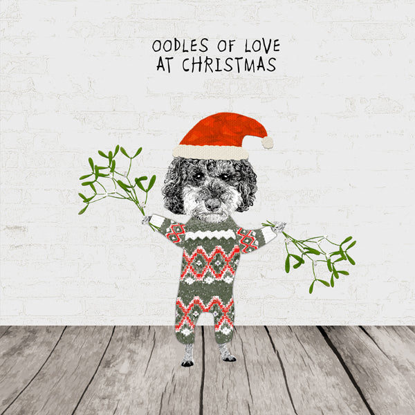 Poodle dog in Christmas gear with mistletoe and text: Oodles of love at Christmas